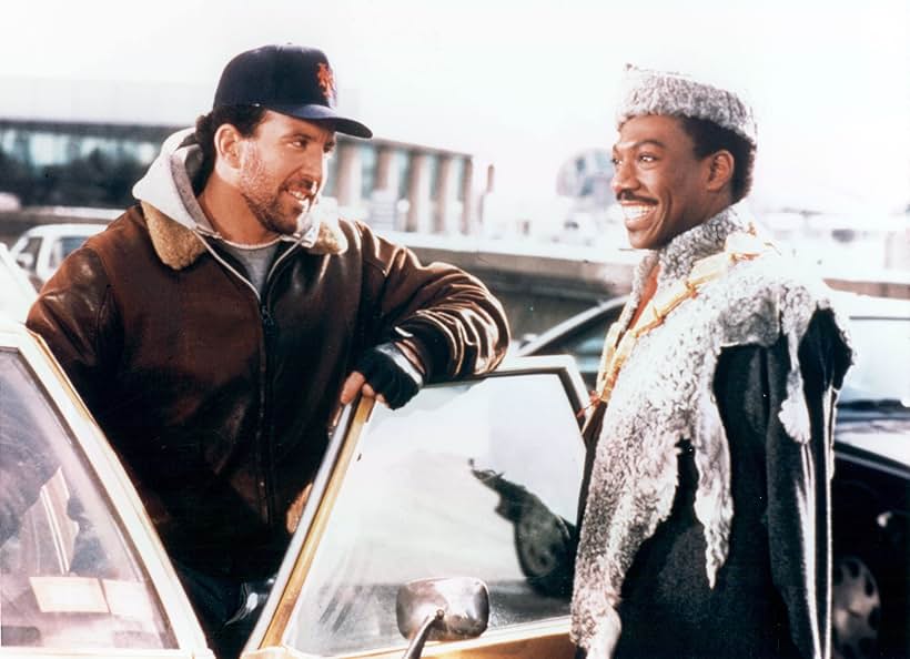 Eddie Murphy and Jake Steinfeld in Coming to America (1988)