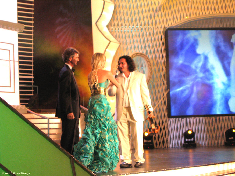 Special Guest performer Olen Cesari greeted on stage by Edward Villaume and Alketa Vejsiu