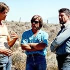 KEVIN BACON, Director RON UNDERWOOD and FRED WARD on the set of TREMORS.