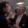 Bill Murray and John Forsythe in Scrooged (1988)