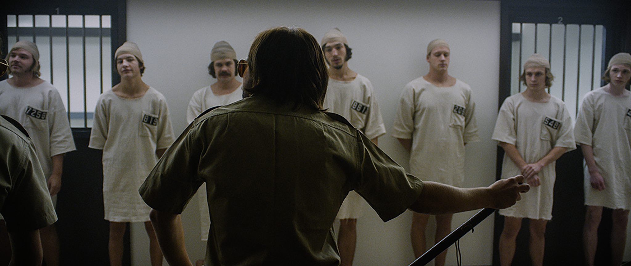 Michael Angarano, Chris Sheffield, Brett Davern, Johnny Simmons, Logan Miller, Ezra Miller, Tye Sheridan, and Jack Kilmer in The Stanford Prison Experiment (2015)