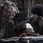 John Hurt and Chris Evans in Snowpiercer (2013)