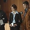 Nathan Fillion, Stana Katic, and Kevin Jiggetts in Castle (2009)