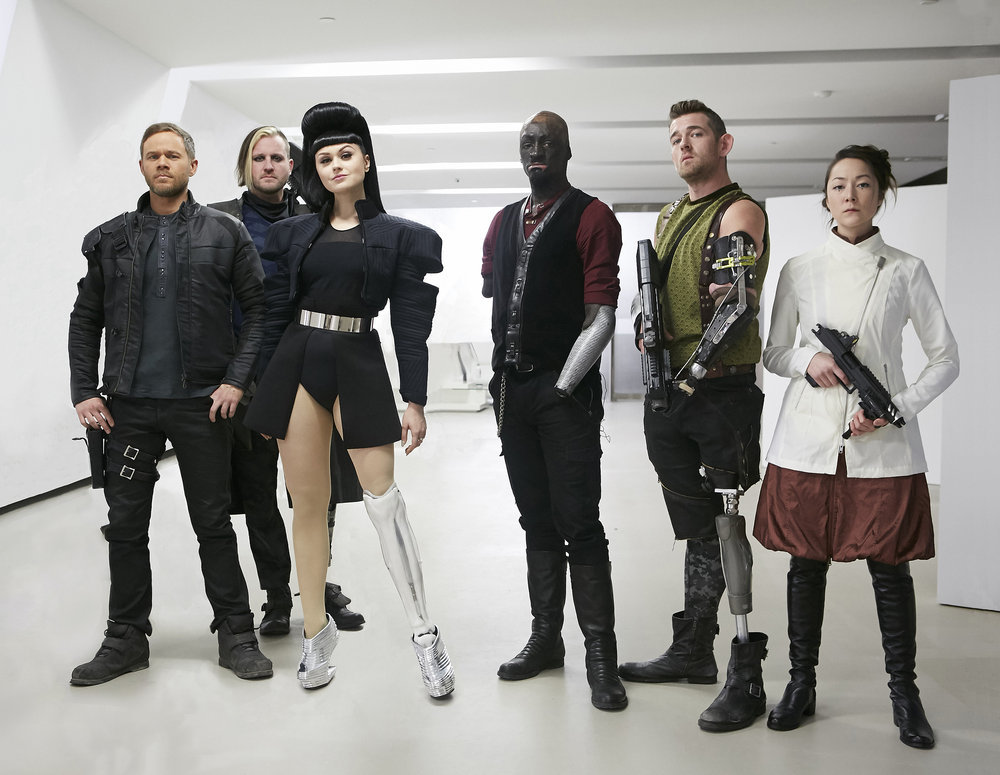 Aaron Ashmore, Emily Piggford, and Viktoria Modesta in Killjoys (2015)