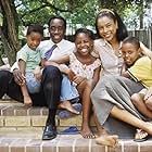 Don Cheadle, Mosa Kaiser, Sophie Okonedo, Ofentse Modiselle, and Mathabo Pieterson in Hotel Rwanda (2004)