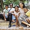 Don Cheadle, Mosa Kaiser, Sophie Okonedo, Ofentse Modiselle, and Mathabo Pieterson in Hotel Rwanda (2004)