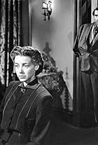 Trevor Bardette and Marsha Hunt in None Shall Escape (1944)