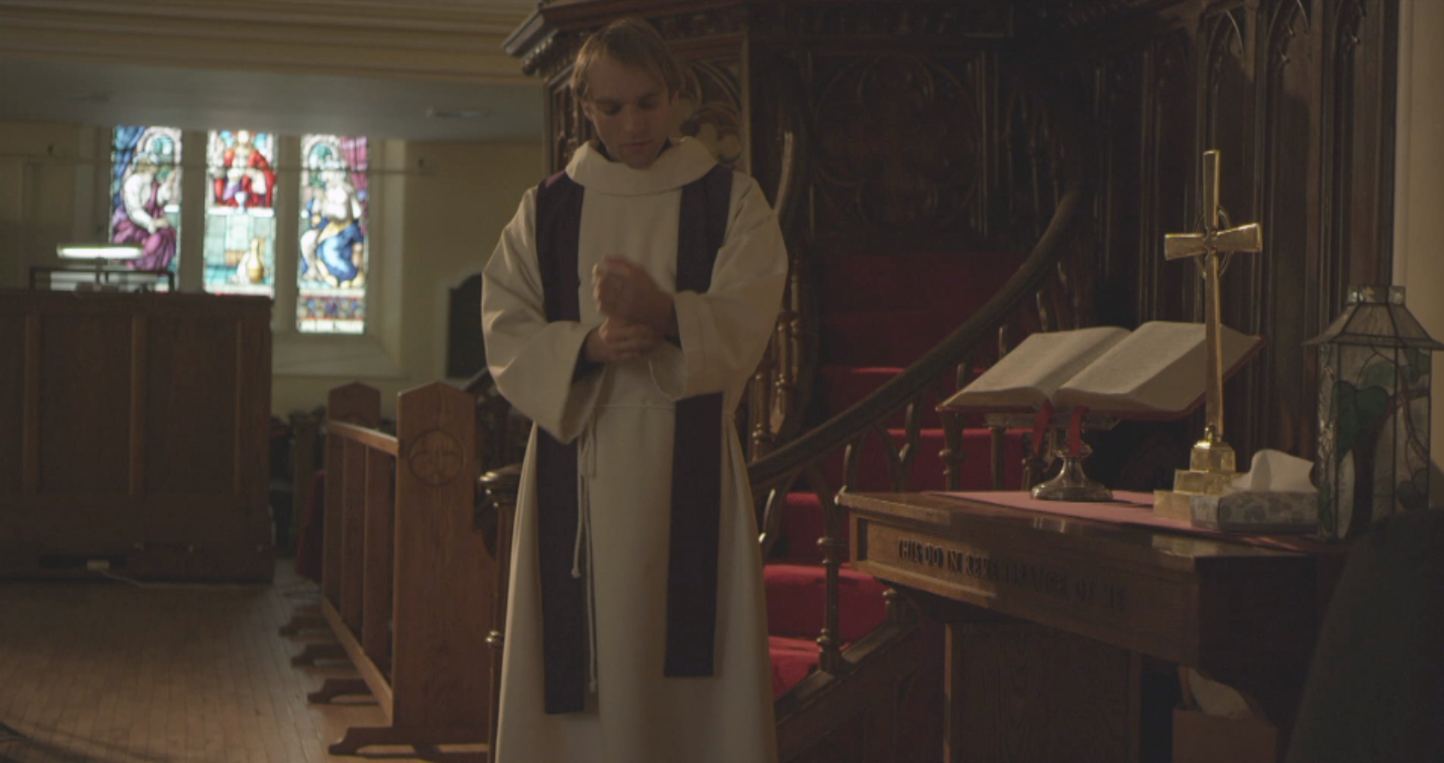 The Priest prepares to hear confessions in Forgive Me. 