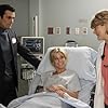 Julie Bowen, Ty Burrell, and Beverly Leech in Modern Family (2009)