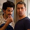 Sam Rockwell and Ben Schwartz in Blue Iguana (2018)