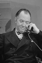 Milton Kibbee in When Strangers Marry (1944)