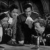 John Carradine, Charles Laughton, Sheldon Leonard, and Gilbert Roland in Captain Kidd (1945)