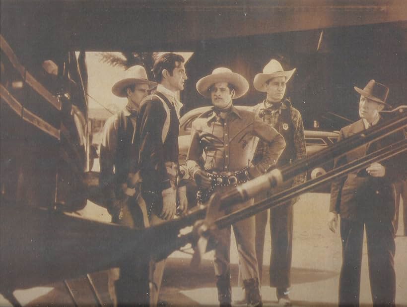 Sammy Baugh, Howard Hughes, Kermit Maynard, and Duncan Renaldo in King of the Texas Rangers (1941)