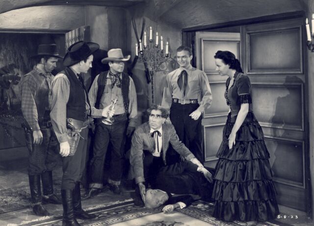 Don 'Red' Barry, Virginia Carroll, Milburn Stone, and Nick Thompson in The Phantom Cowboy (1941)