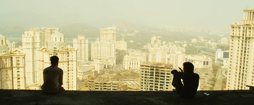 Dev Patel and Madhur Mittal in Slumdog Millionaire (2008)