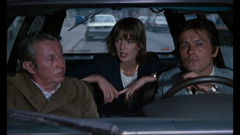 Alain Delon, Anne Parillaud, and Michel Auclair in To Kill a Cop (1981)