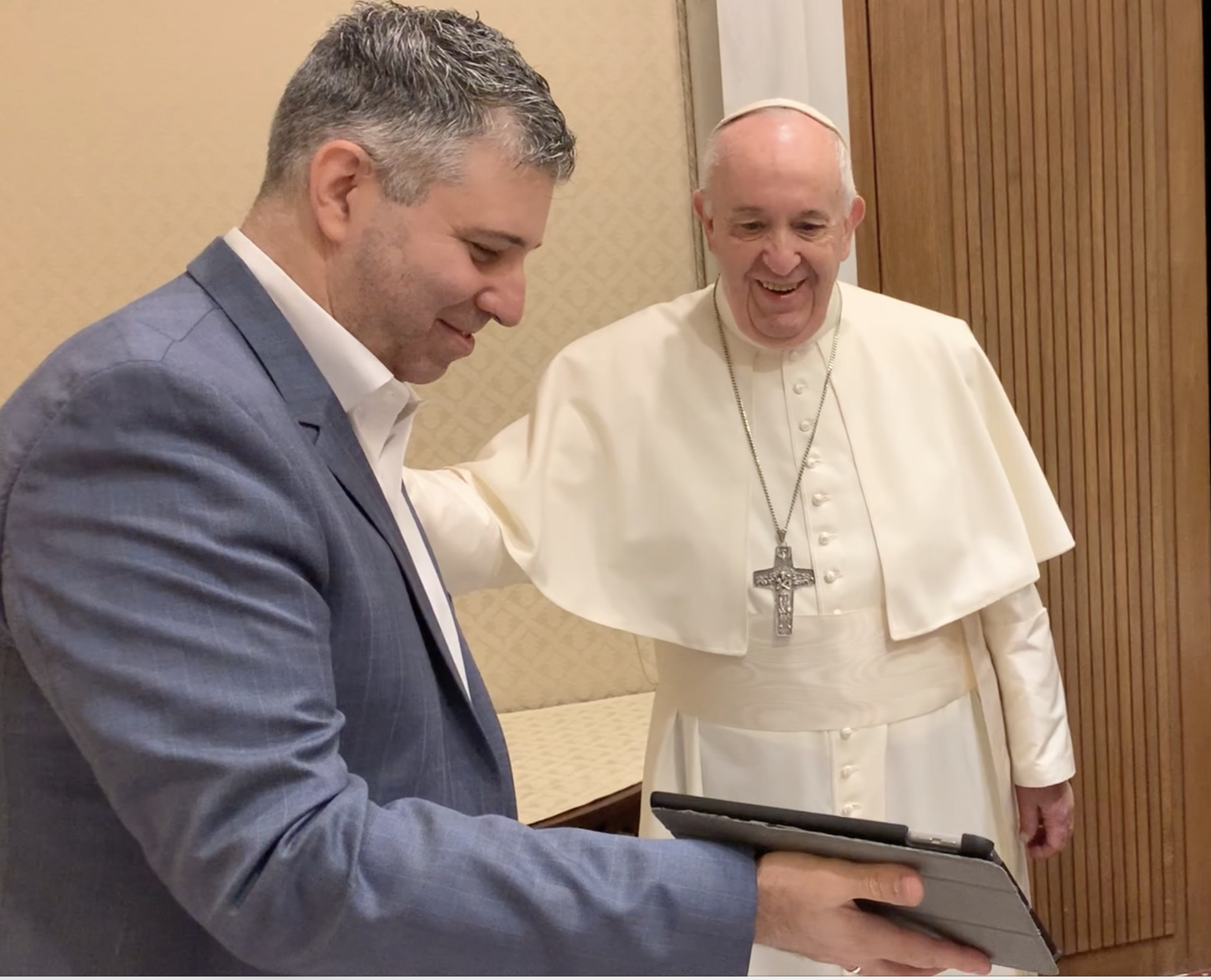 Director Evgeny Afineevsky, showing parts of the movie to Pope Francis