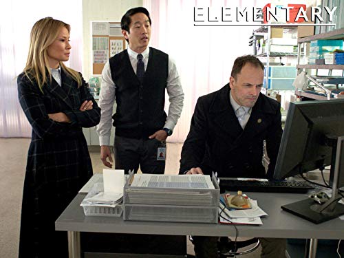 Jonny Lee Miller, Lucy Liu, and Eric Elizaga in Elementary (2012)