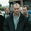 Jude Law, Konstantin Khabenskiy, Sergey Kolesnikov, Michael Smiley, David Threlfall, Sergey Veksler, Branwell Donaghey, Scoot McNairy, Yuri Klimov, and Sergey Puskepalis in Black Sea (2014)