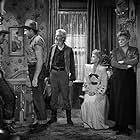 John Wayne, George 'Gabby' Hayes, Marjorie Rambeau, Martha Scott, and Grant Withers in In Old Oklahoma (1943)