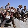 Kevin Bacon, Ariana Richards, Finn Carter, Tony Genaro, Bobby Jacoby, Charlotte Stewart, and Fred Ward in Tremors (1990)