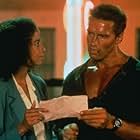 Arnold Schwarzenegger and Rae Dawn Chong in Commando (1985)