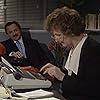 Peter Bowles and Penelope Keith in Executive Stress (1986)