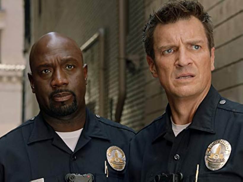 Nathan Fillion and Richard T. Jones in Impact (2019)