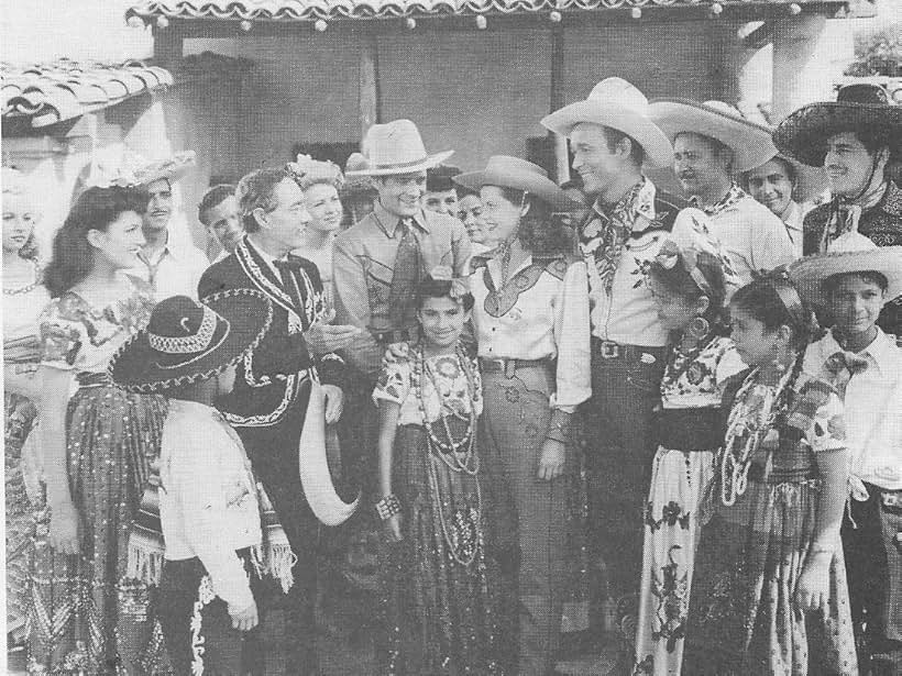 Roy Rogers, Sherry Cameron, Ken Carson, Janet Martin, Duncan Renaldo, Julian Rivero, and Ruth Terry in Hands Across the Border (1944)