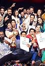 Kunchacko Boban, Lal Jose, Shambhu Menon, Venkitesh V.P., R. Viswa, Roshan Ullas, Meenakshi Raveendran, Thejas Jyothi, Malavika Krishnadas, Sidhi Vinayak, Ann Jameela Saleem, Nandu Anand, Aswathy Sreekanth, Amina Nijam, Vincy Aloshious, Samvrutha Sunil, Dain Davis, and Addis Akkara in Nayika Nayakan (2018)