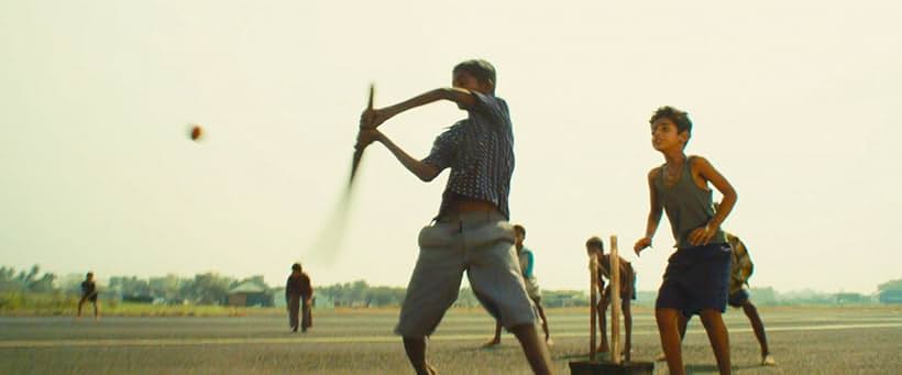 Azharuddin Mohammed Ismail and Ayush Mahesh Khedekar in Slumdog Millionaire (2008)