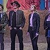 Woody Harrelson, Jesse Eisenberg, Abigail Breslin, and Emma Stone in Zombieland: Double Tap (2019)