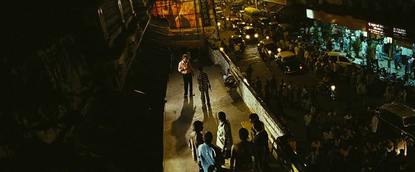 Mahesh Manjrekar, Amit Leonard Toppo, and Ashutosh Lobo Gajiwala in Slumdog Millionaire (2008)