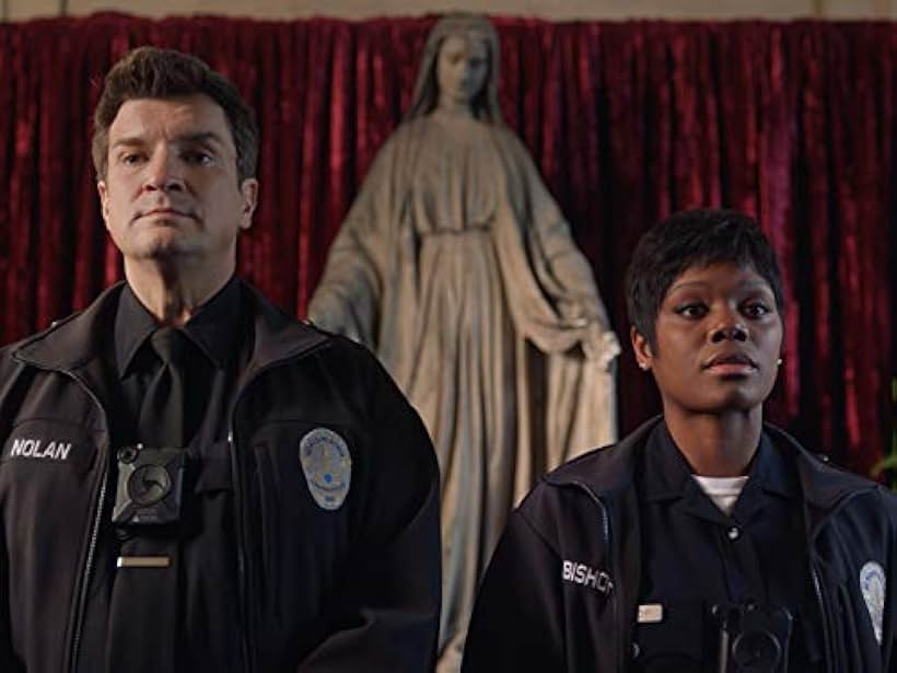 Nathan Fillion and Afton Williamson in The Rookie (2018)