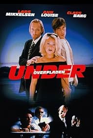 Claes Bang, Ann-Louise Mathiasen, and Lars Mikkelsen in Under overfladen (1999)