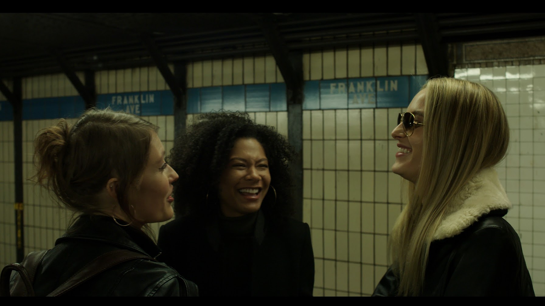 Allie Cizek, Summer Spears, and Emilie Paap in In Transit (2020)