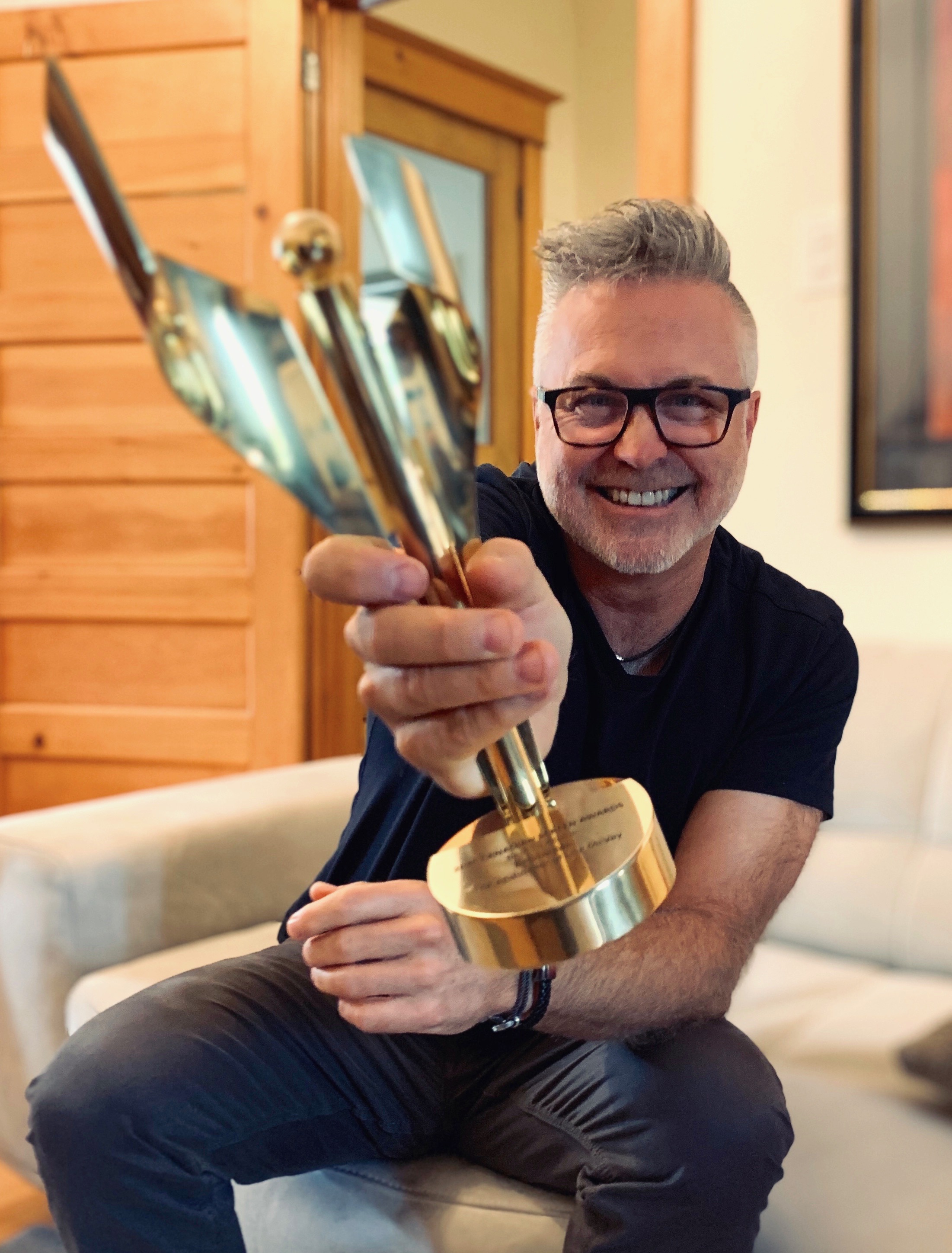 Jim showing off his 2020 Canadian Screen Award for best television movie for "Believe Me".