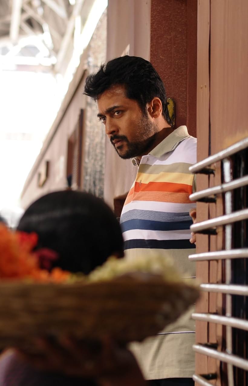 Ramya Krishnan, Suriya, and Keerthy Suresh in Thaanaa Serndha Koottam (2018)