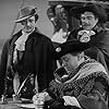 Charles Laughton, Sheldon Leonard, and Gilbert Roland in Captain Kidd (1945)