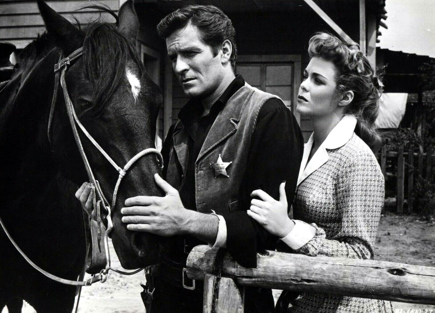 Nancy Gates and Hugh O'Brian in The Brass Legend (1956)