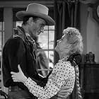 John Wayne and Martha Scott in In Old Oklahoma (1943)