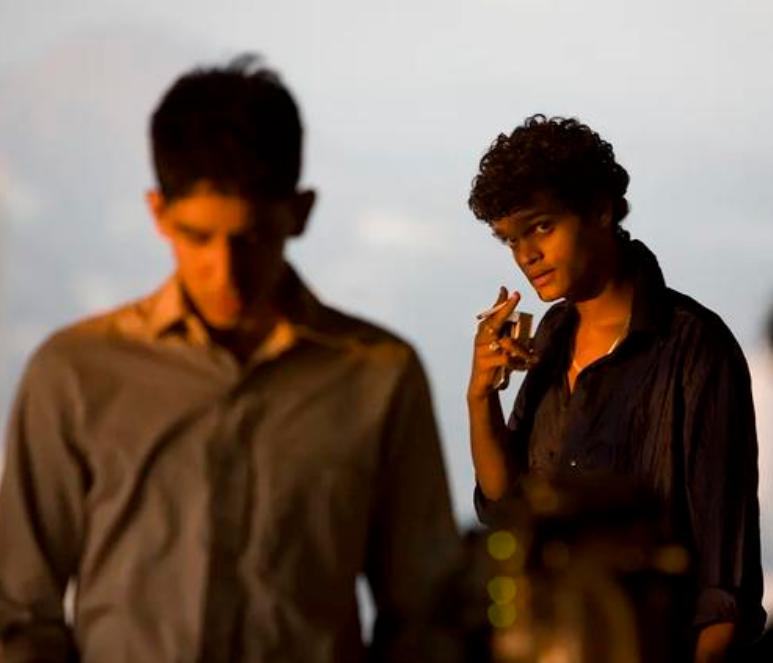 Dev Patel and Madhur Mittal in Slumdog Millionaire (2008)