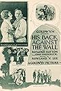 Raymond Hatton and Virginia Valli in His Back Against the Wall (1922)