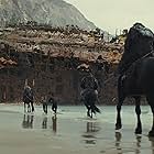 Eka Darville, Owen Teague, Freya Allan, and Ras-Samuel in Kingdom of the Planet of the Apes (2024)