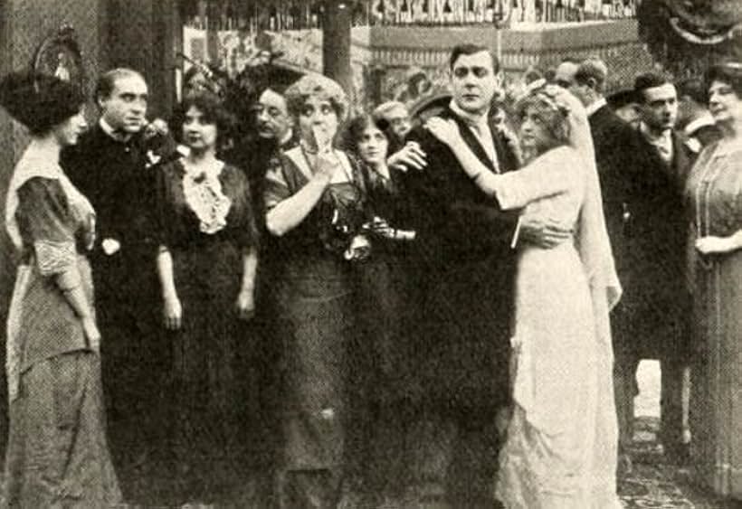 Charles Arling and Gwendolyn Pates in The Elusive Kiss (1913)