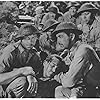 Robert Taylor, Lee Bowman, Roque Espiritu, Thomas Mitchell, George Murphy, Barry Nelson, Phil Schumacher, and Robert Walker in Bataan (1943)