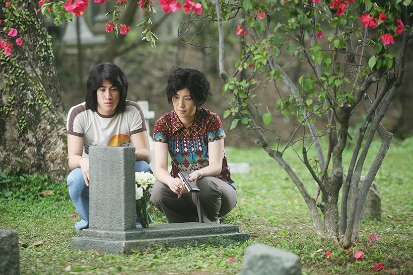 Sandra Kwan Yue Ng and Aarif Lee in Echoes of the Rainbow (2010)