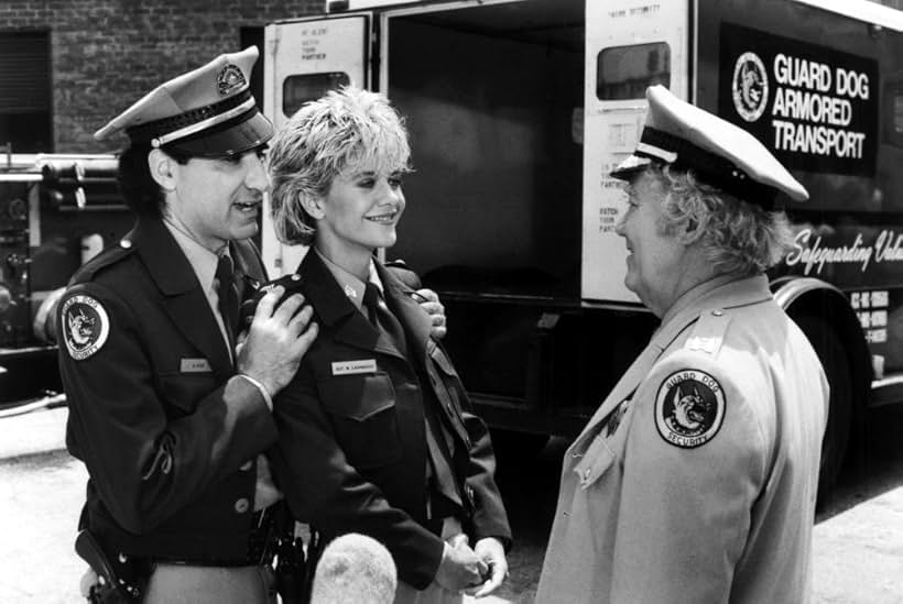 Meg Ryan, Eugene Levy, and Kenneth McMillan in Armed and Dangerous (1986)