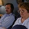 Peter Bowles and Penelope Keith in Executive Stress (1986)