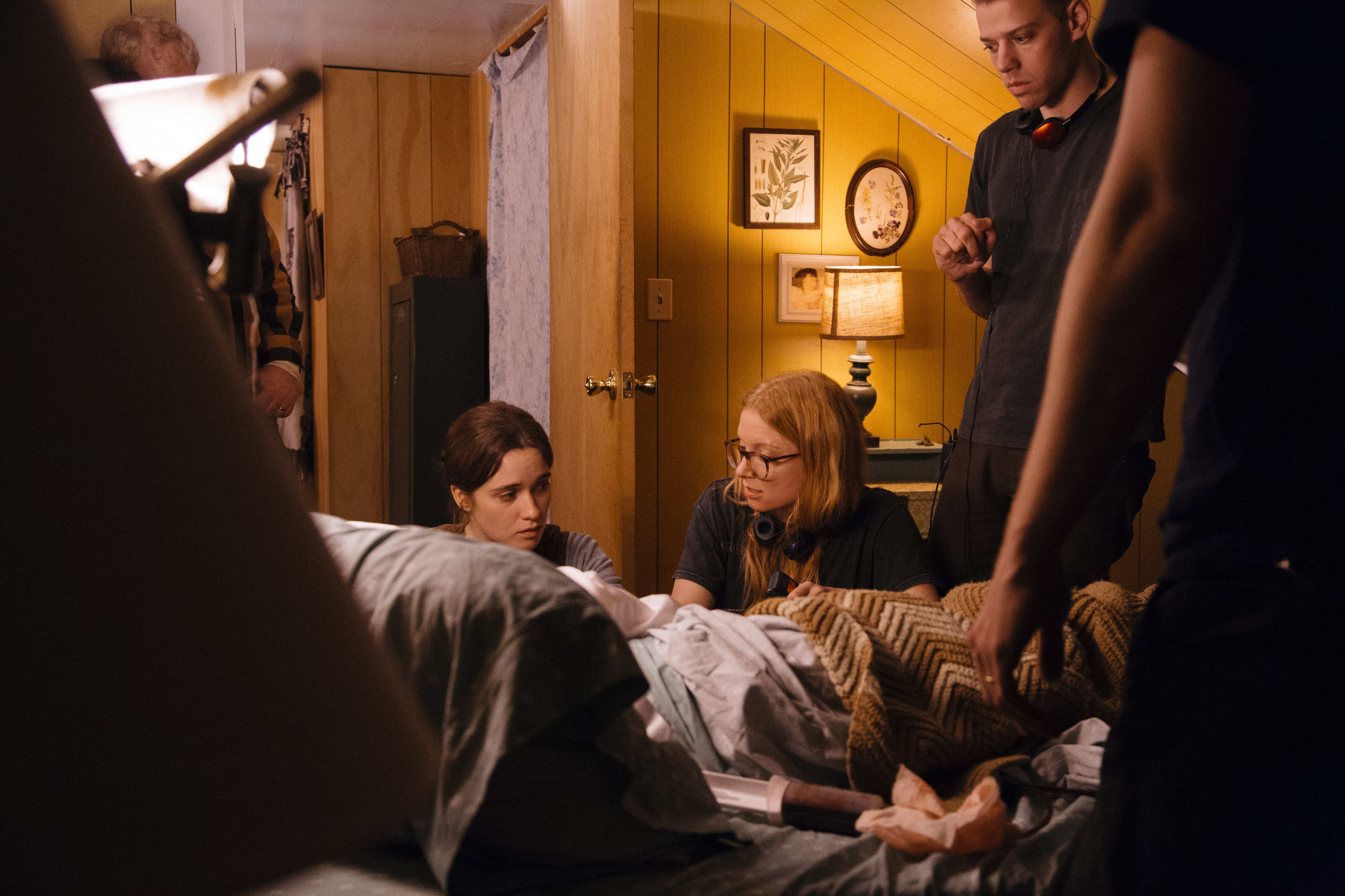 Director Britt Poulton talking to actress Alice Englert on the set of Them That Follow